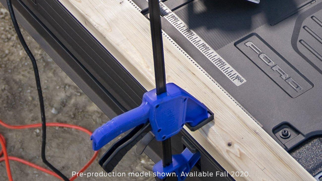 Ford F-150 Another teaser pic showing hard plastic tailgate protector? 2021 F150 tailgate plastic protector