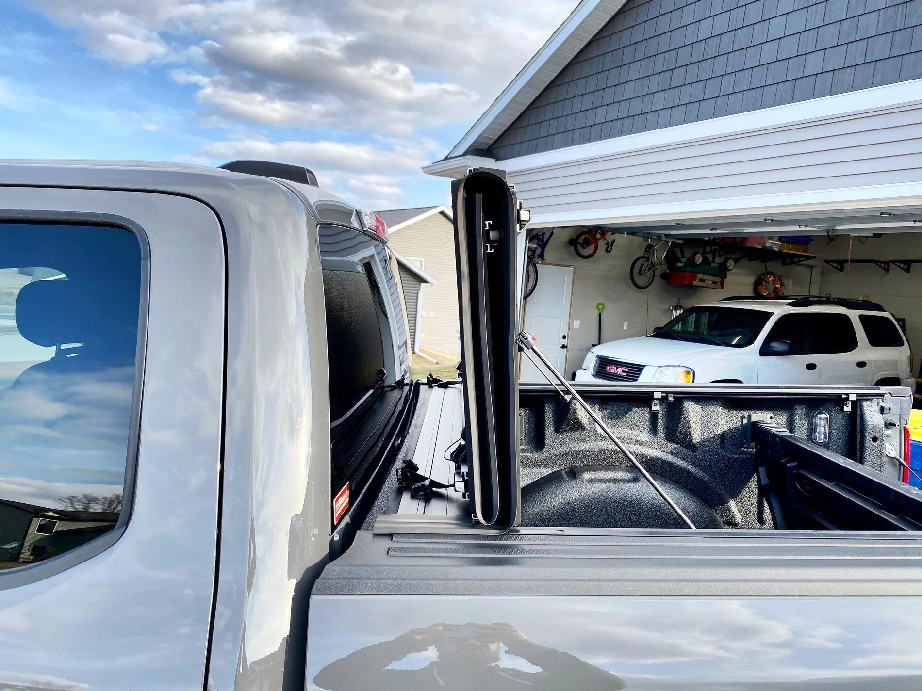 Ford F-150 Finally got my bed setup: bed liner, tonneau cover, and bed divider. 248A808E-F26B-4A97-BF50-2B33B6F230D1