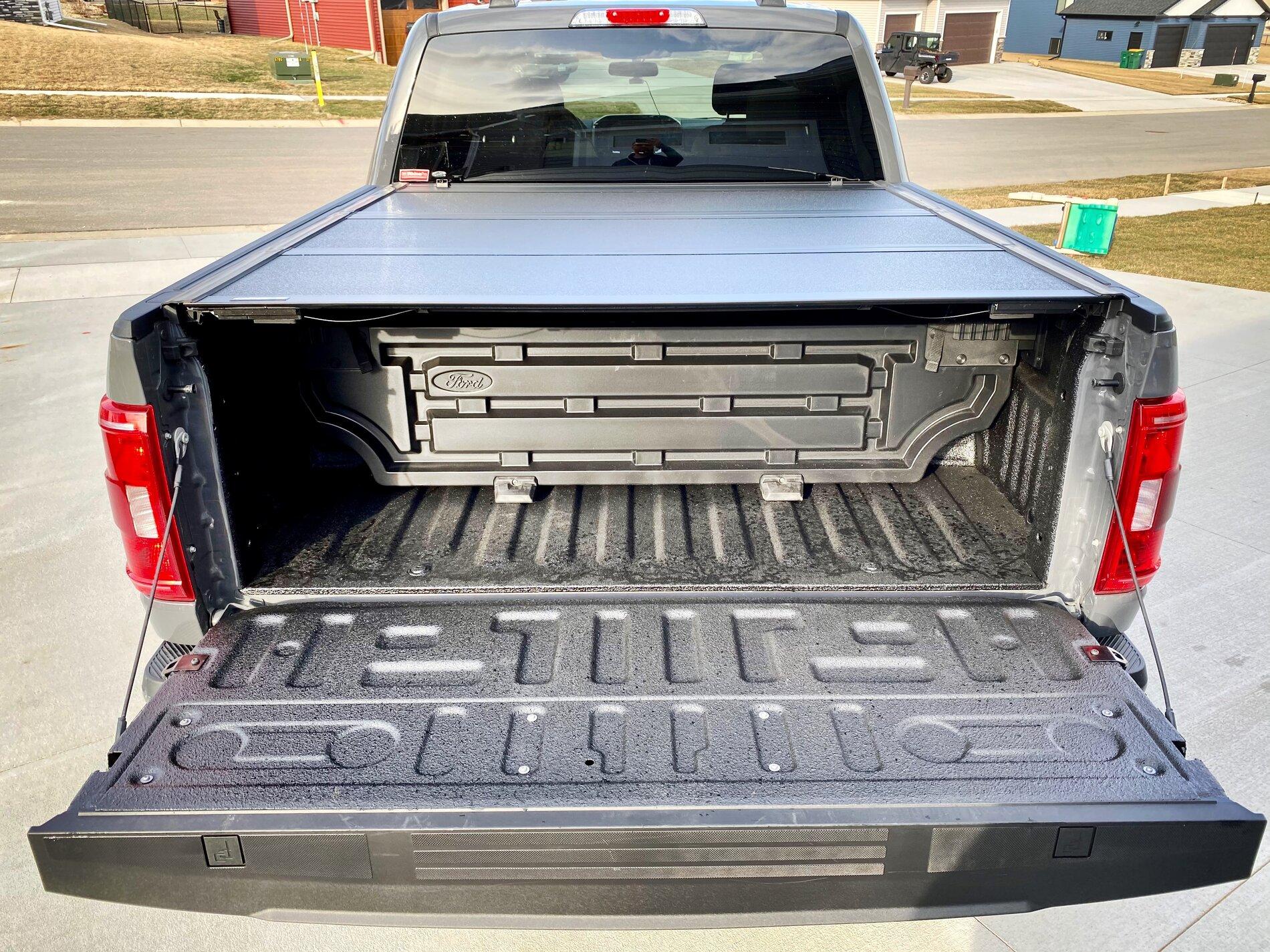 Ford F-150 Finally got my bed setup: bed liner, tonneau cover, and bed divider. 83D78BA0-317D-465E-B62D-21A691FF0799
