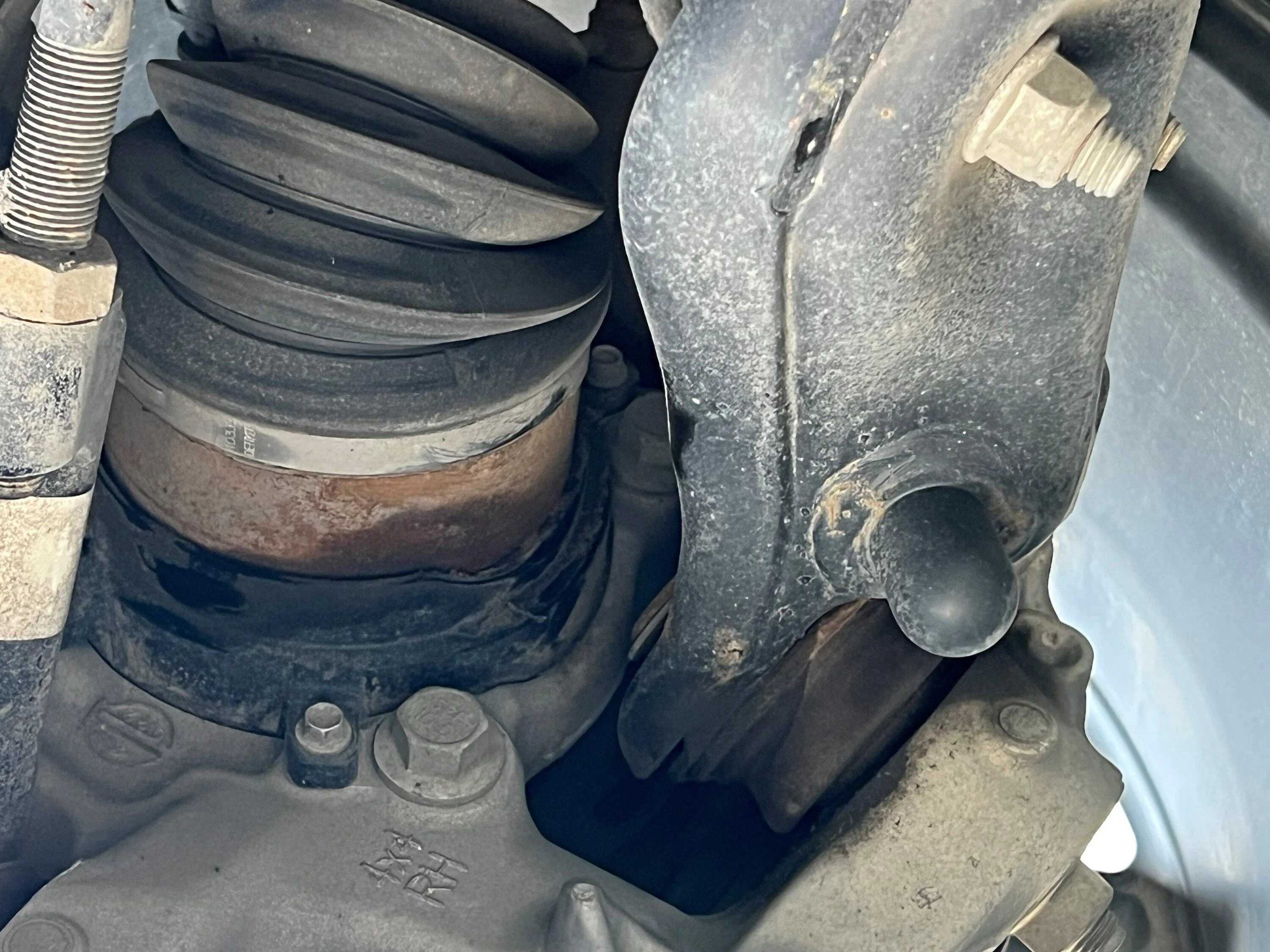 Ford F-150 CV axle oil/wet looking spot on the hub (photo attached) CV