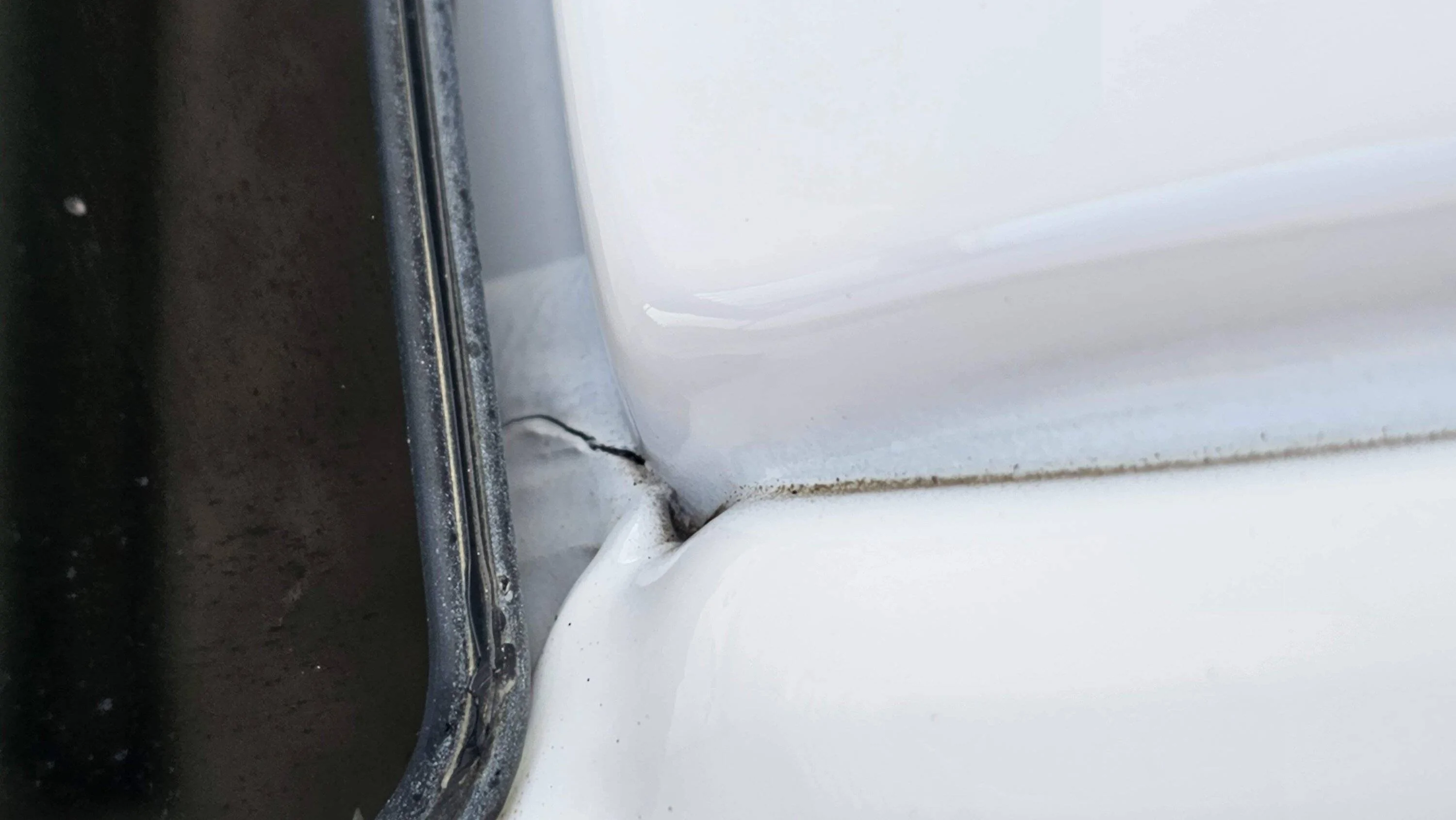 F150 Winshield pillar crack close up.jpg