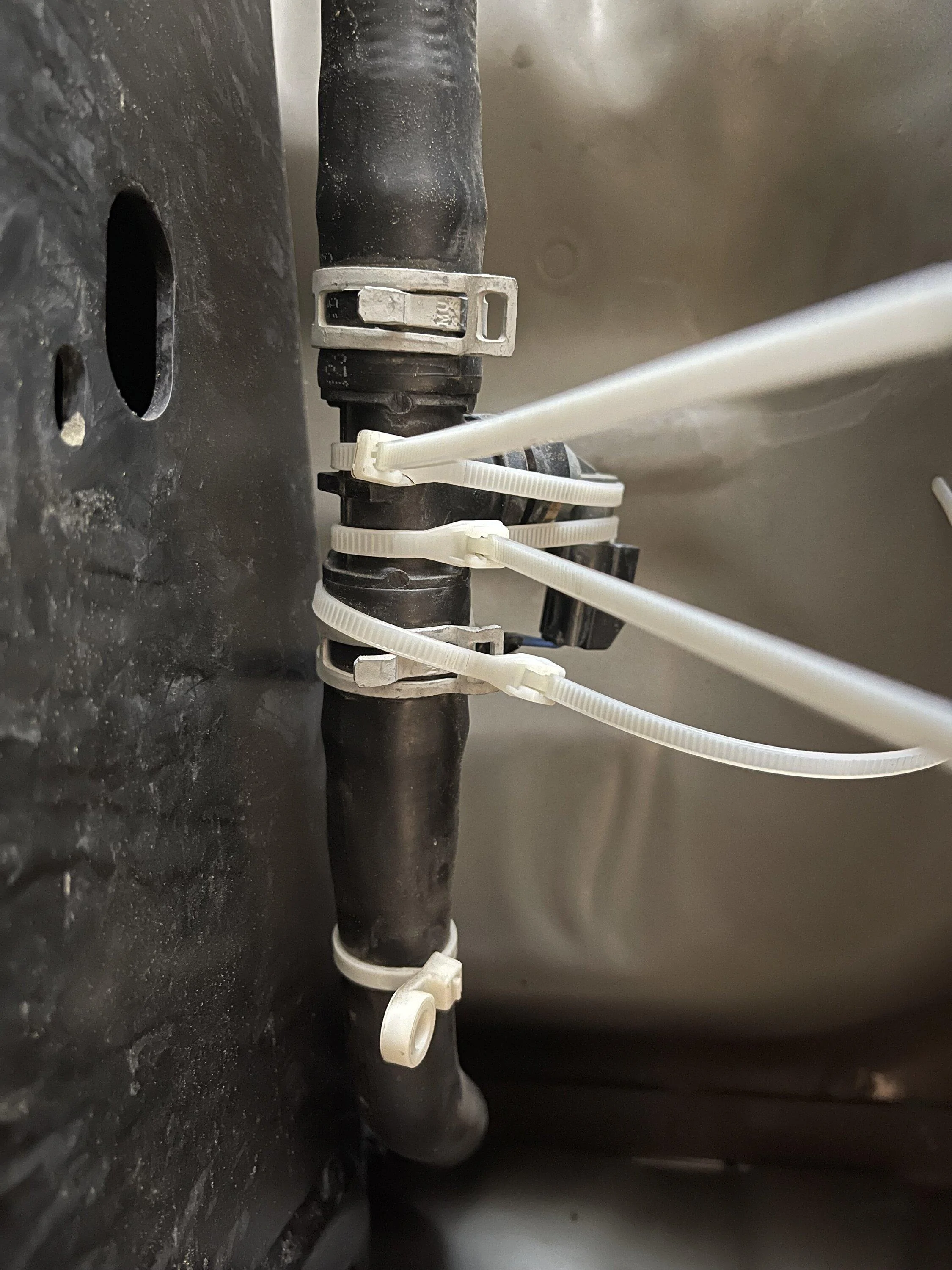 Ford F-150 Broken mount on high-voltage battery coolant line IMG_1888