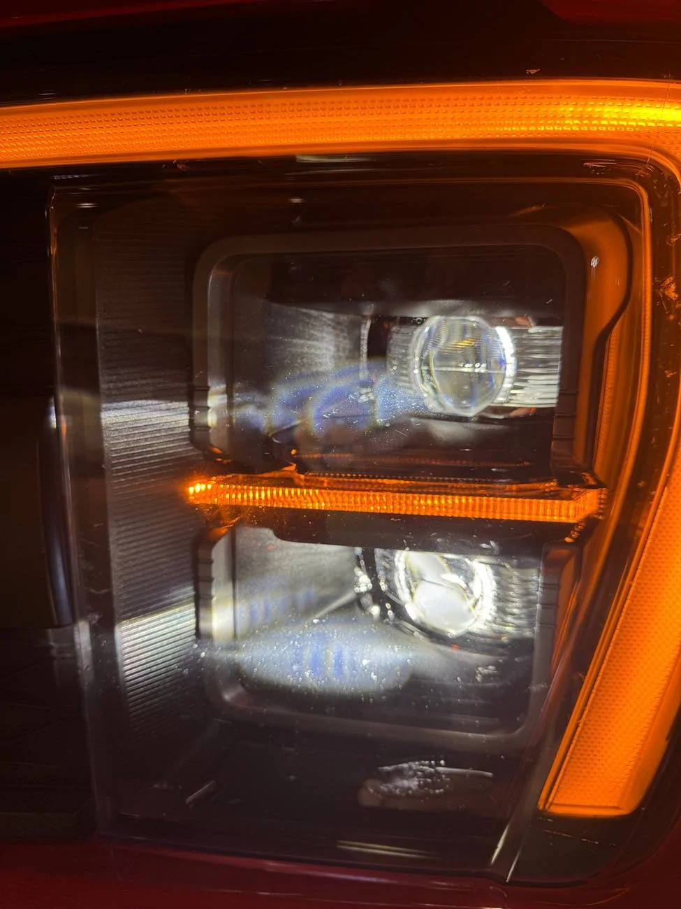 Ford F-150 Any idea what these white marks on my headlights are? IMG_4167