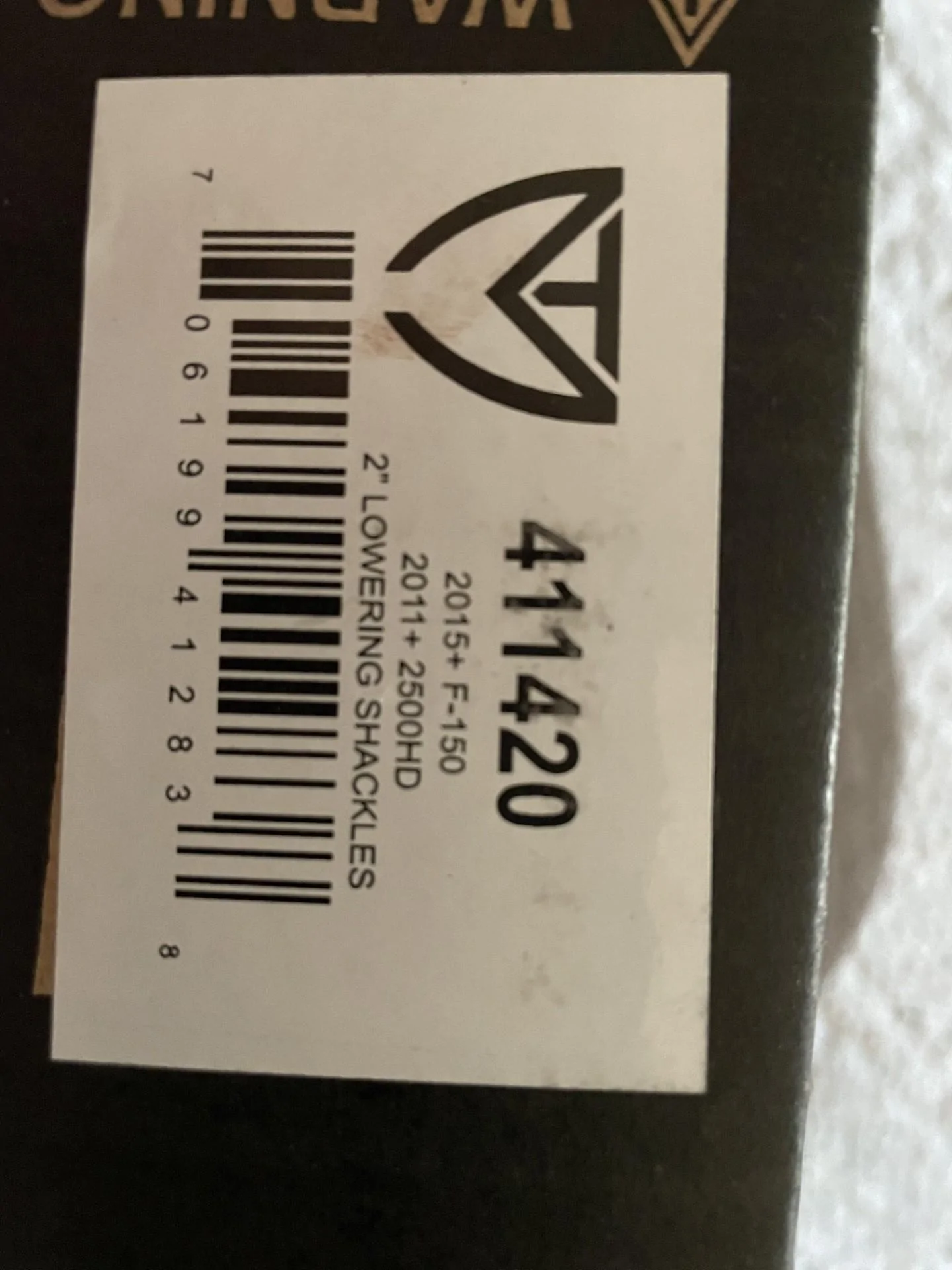 Ford F-150 MaxTrac lowering shackles and 2.5* shims shackle label